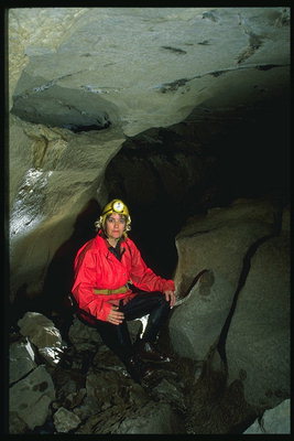 A woman studying a cave