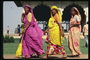 Women in bright costumes. Walk