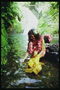 Девушка у горной реки. Украшения с цветов орхидеи