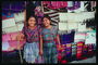 Девушки на фоне разноцветных полотенец и дорожек