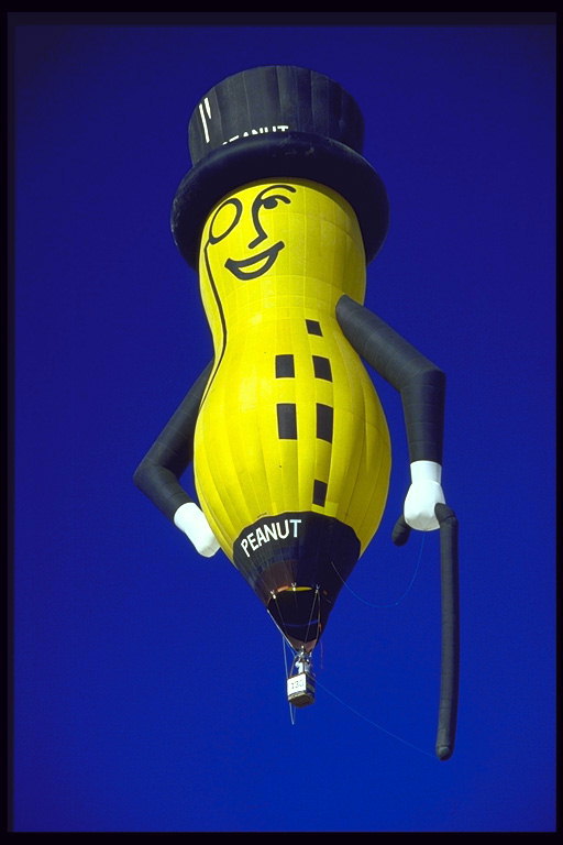 Balloon in the form of peanuts in a black hat