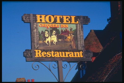 Готель і ресторан. Зображення вози з білими коням
