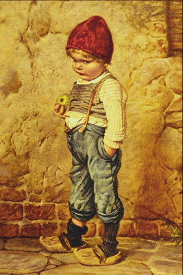Хлопчик в синіх штанах на підтяжка з великим зеленим яблуком в руках