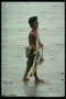 Чоловік з сіткою на березі моря